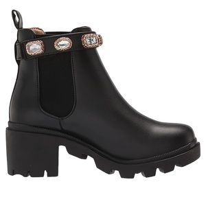 - Women’s amulet boot shiny finish with crystals